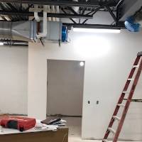 A room under construction with a ladder.